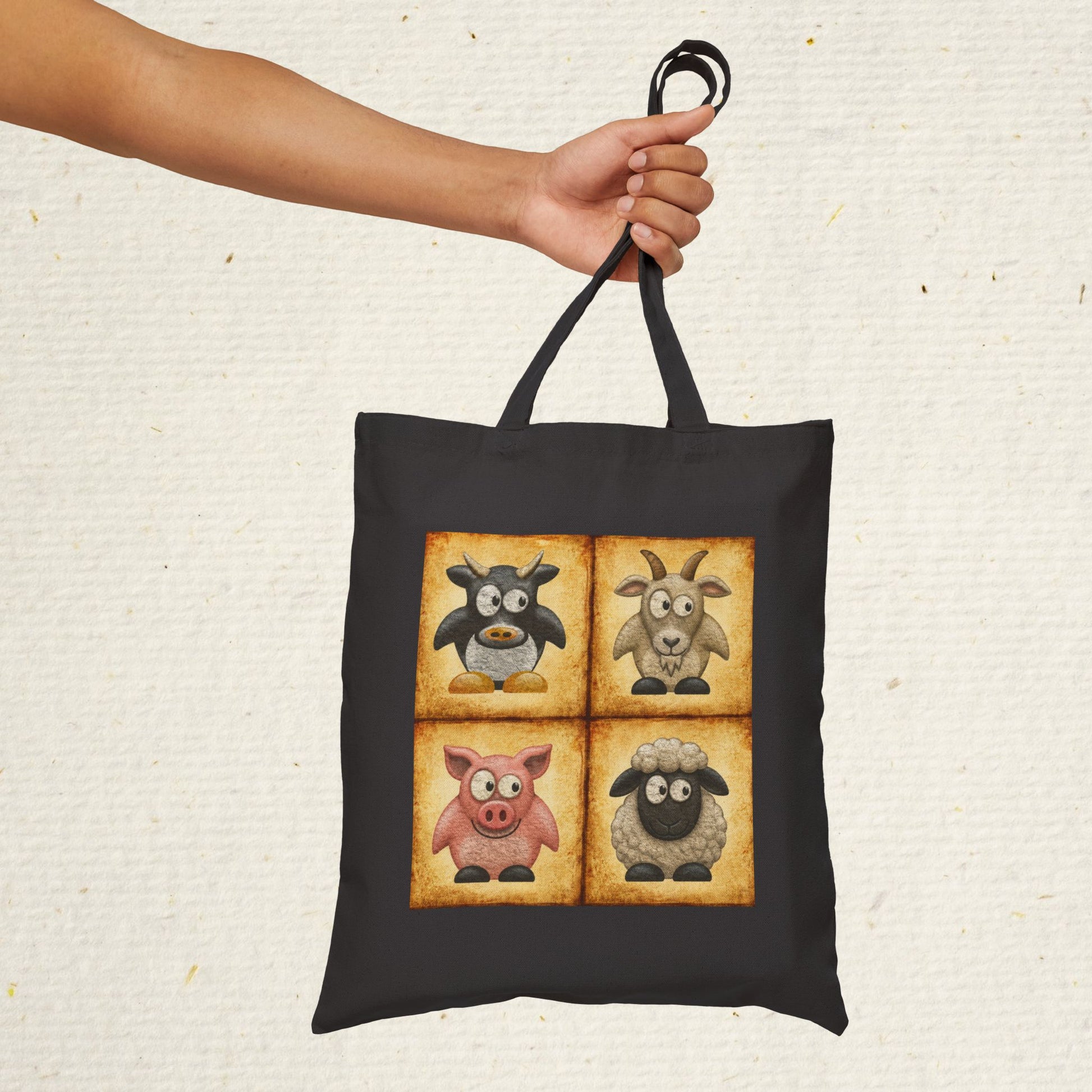 Black cotton canvas tote bag featuring vintage farm animal artwork with cow, goat, pig and sheep illustrations
