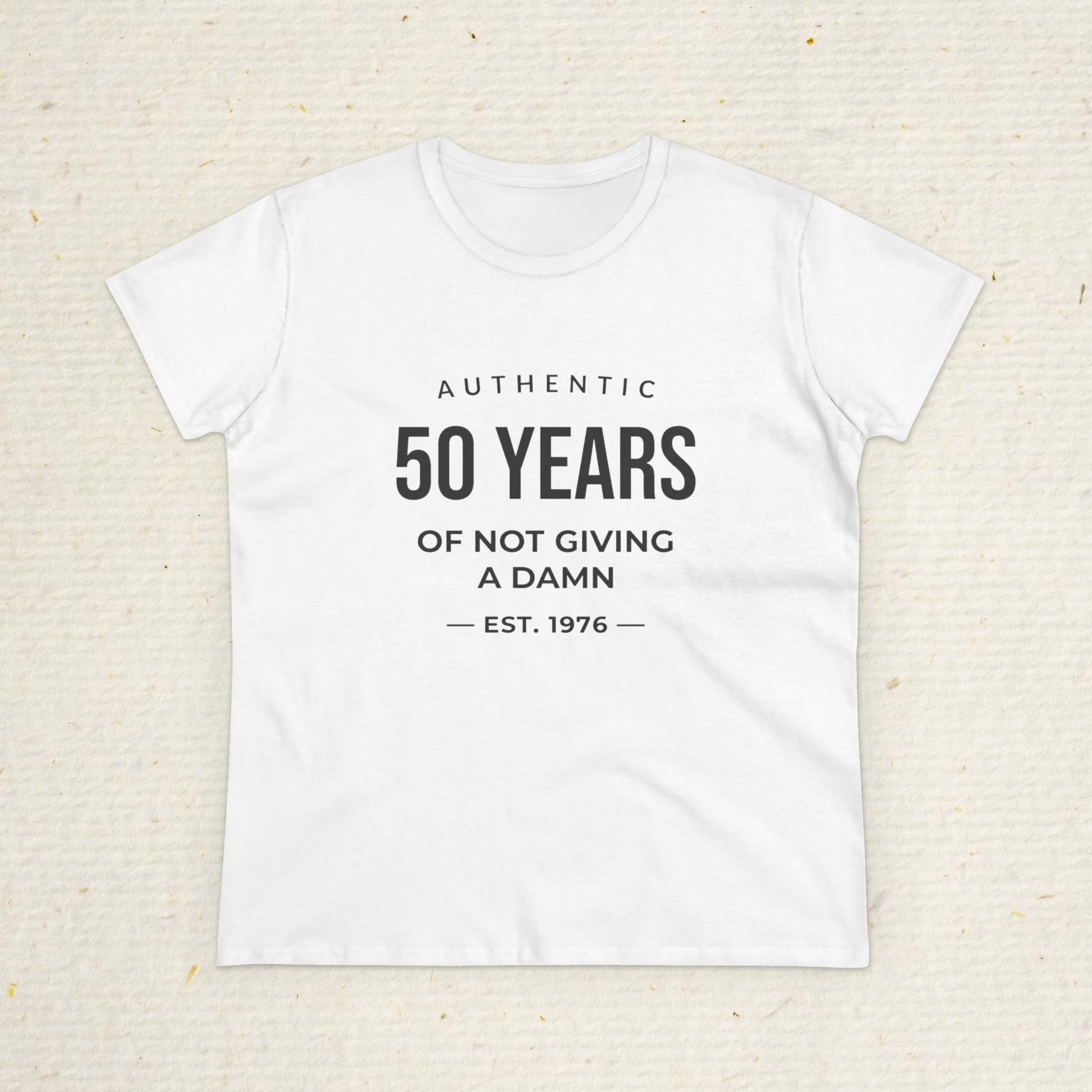 Women's funny 50th birthday t-shirt featuring Authentic 50 Years of Not Giving a Damn Est. 1976 graphic