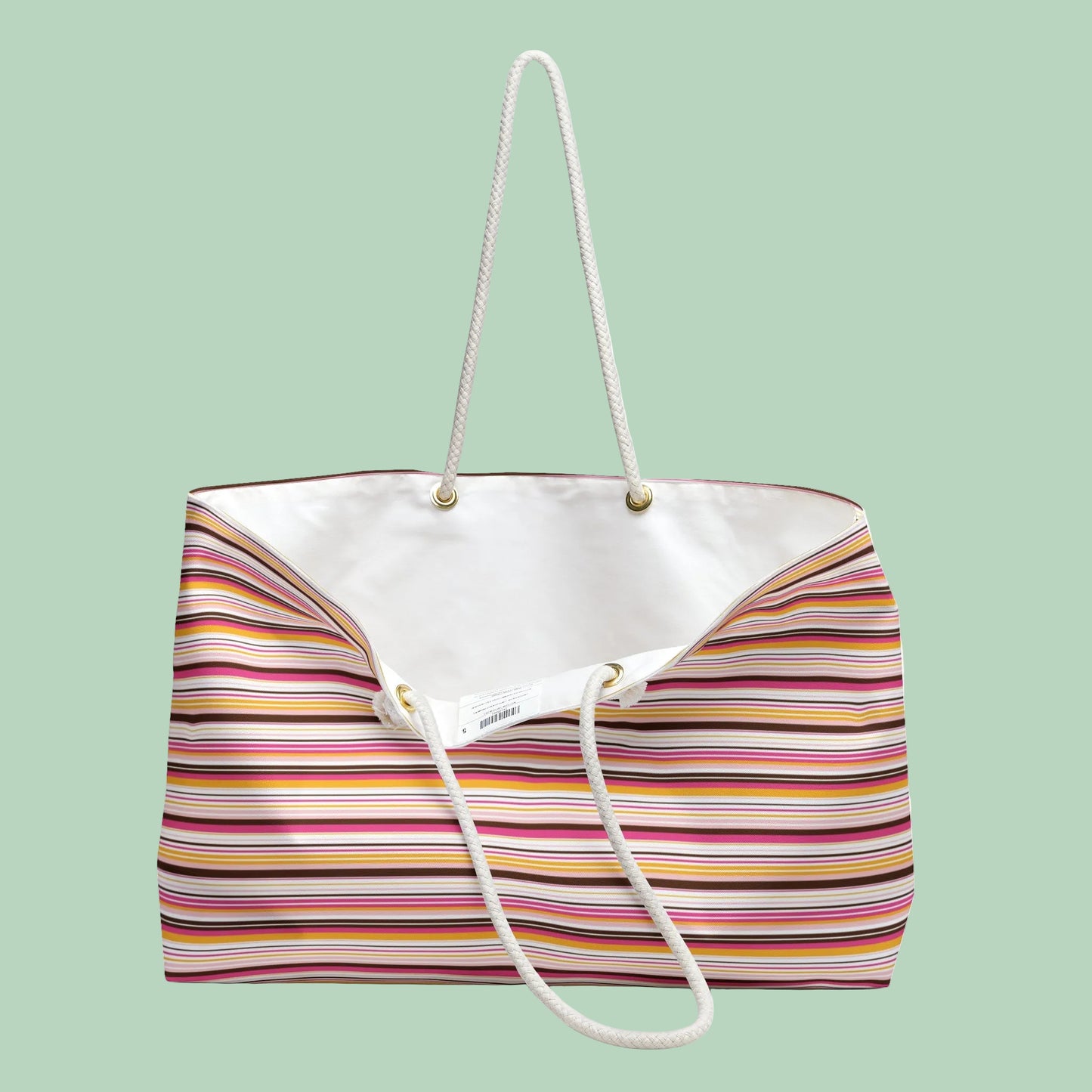 Large retro stripe weekender bag with rope handles in pink, amber and cream stripes