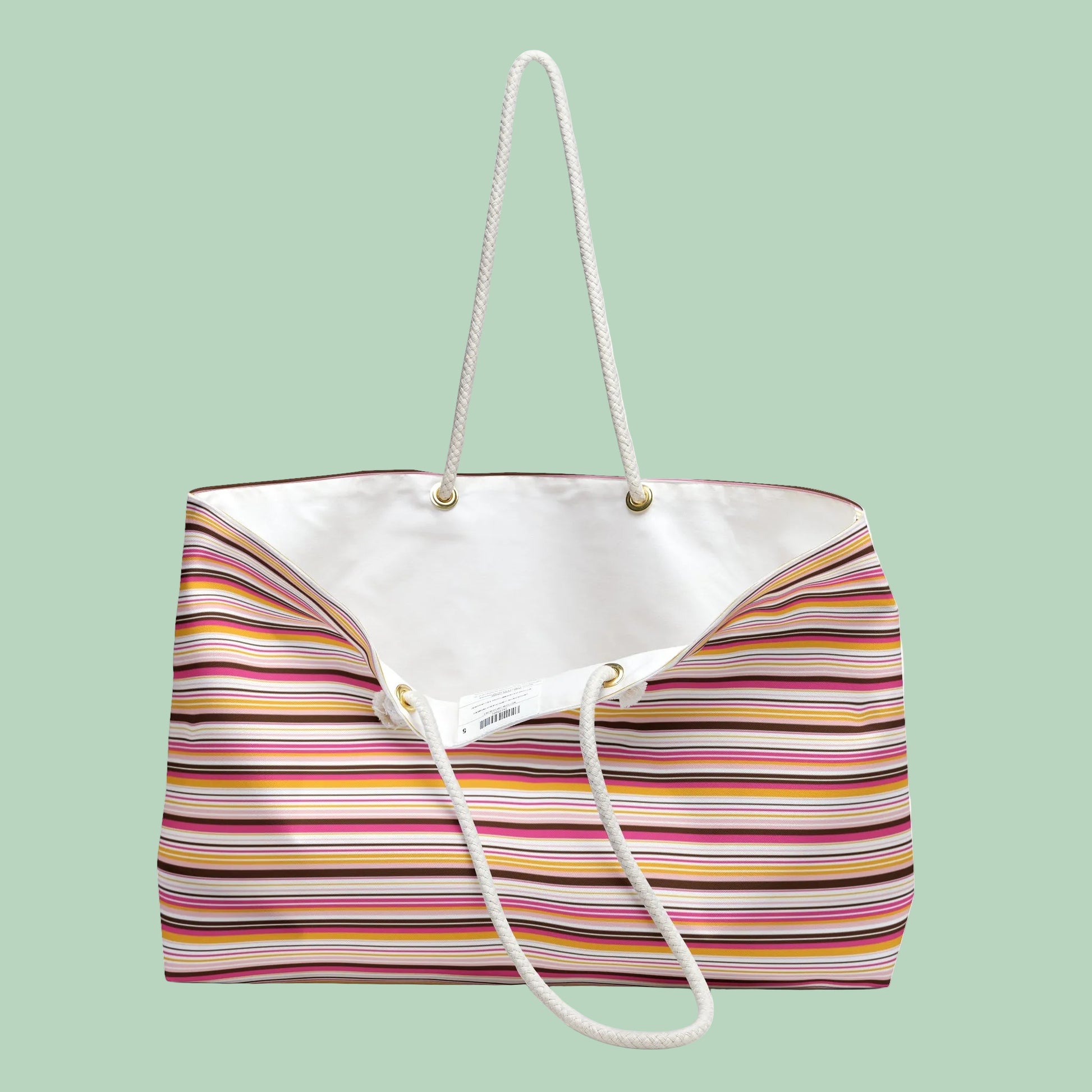 Large retro stripe weekender bag with rope handles in pink, amber and cream stripes