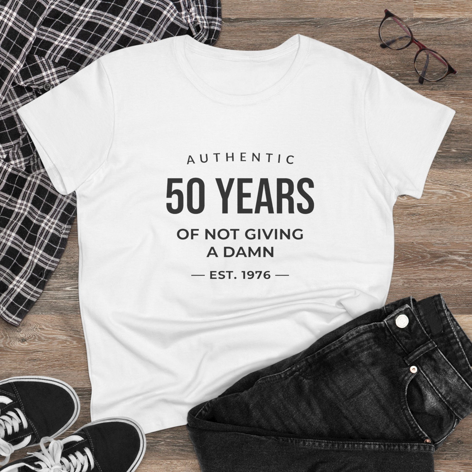 Women's funny 50th birthday t-shirt featuring Authentic 50 Years of Not Giving a Damn Est. 1976 graphic