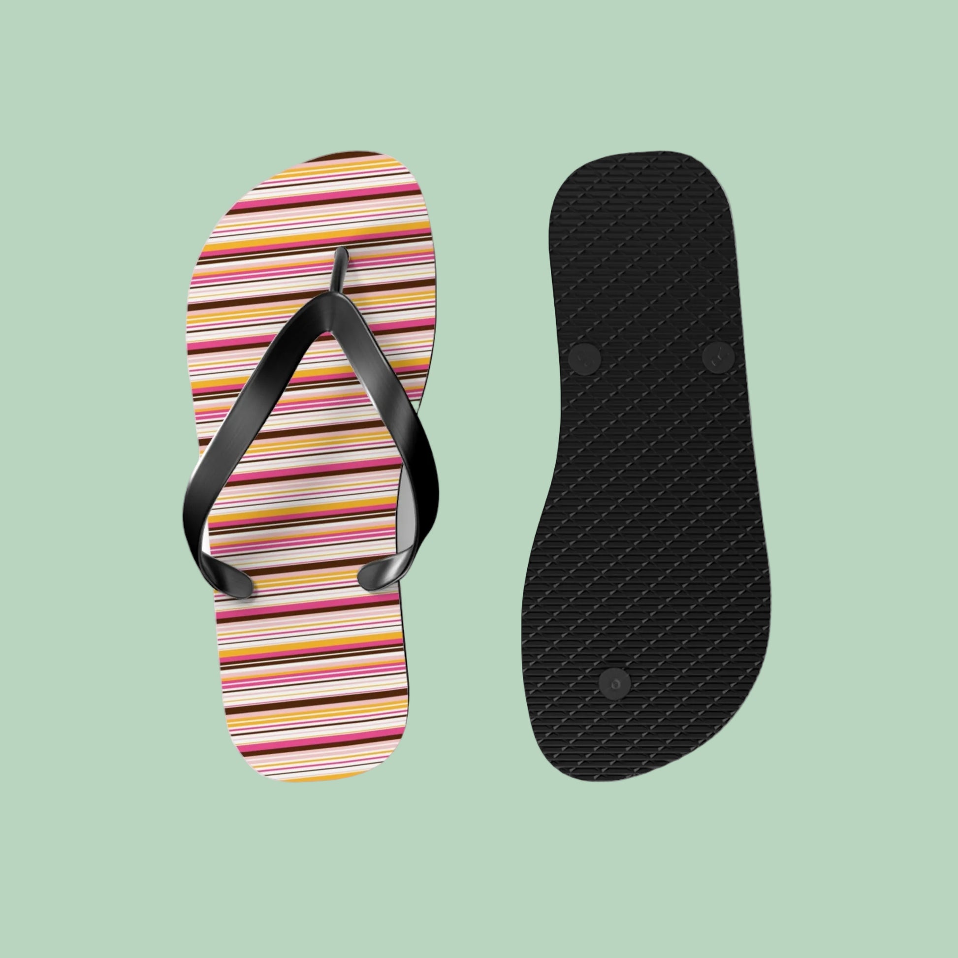 Women’s retro stripe flip flops with colorful 70s-inspired striped pattern and black straps on lightweight summer sandals.