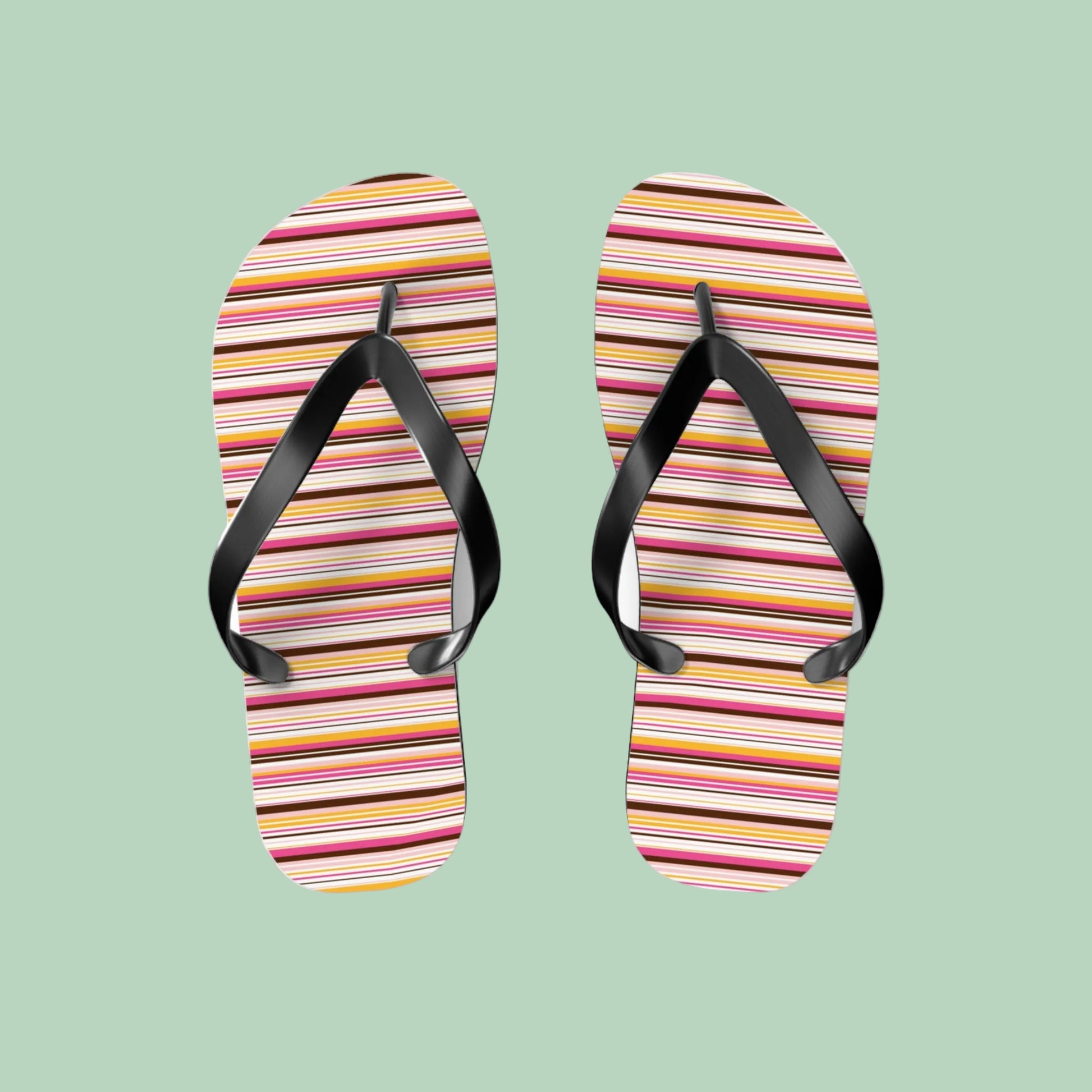 Women’s retro stripe flip flops with colorful 70s-inspired striped pattern and black straps on lightweight summer sandals.