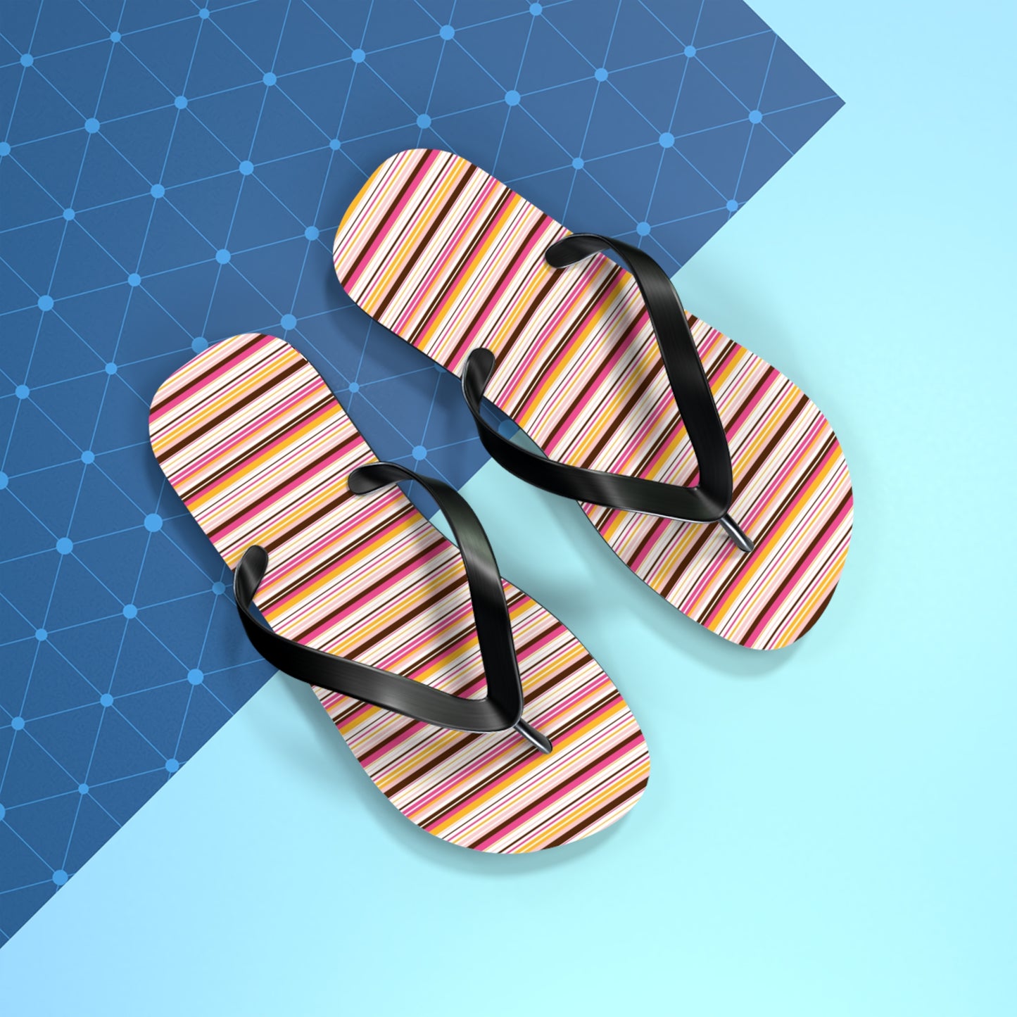Women’s retro stripe flip flops with colorful 70s-inspired striped pattern and black straps on lightweight summer sandals.
