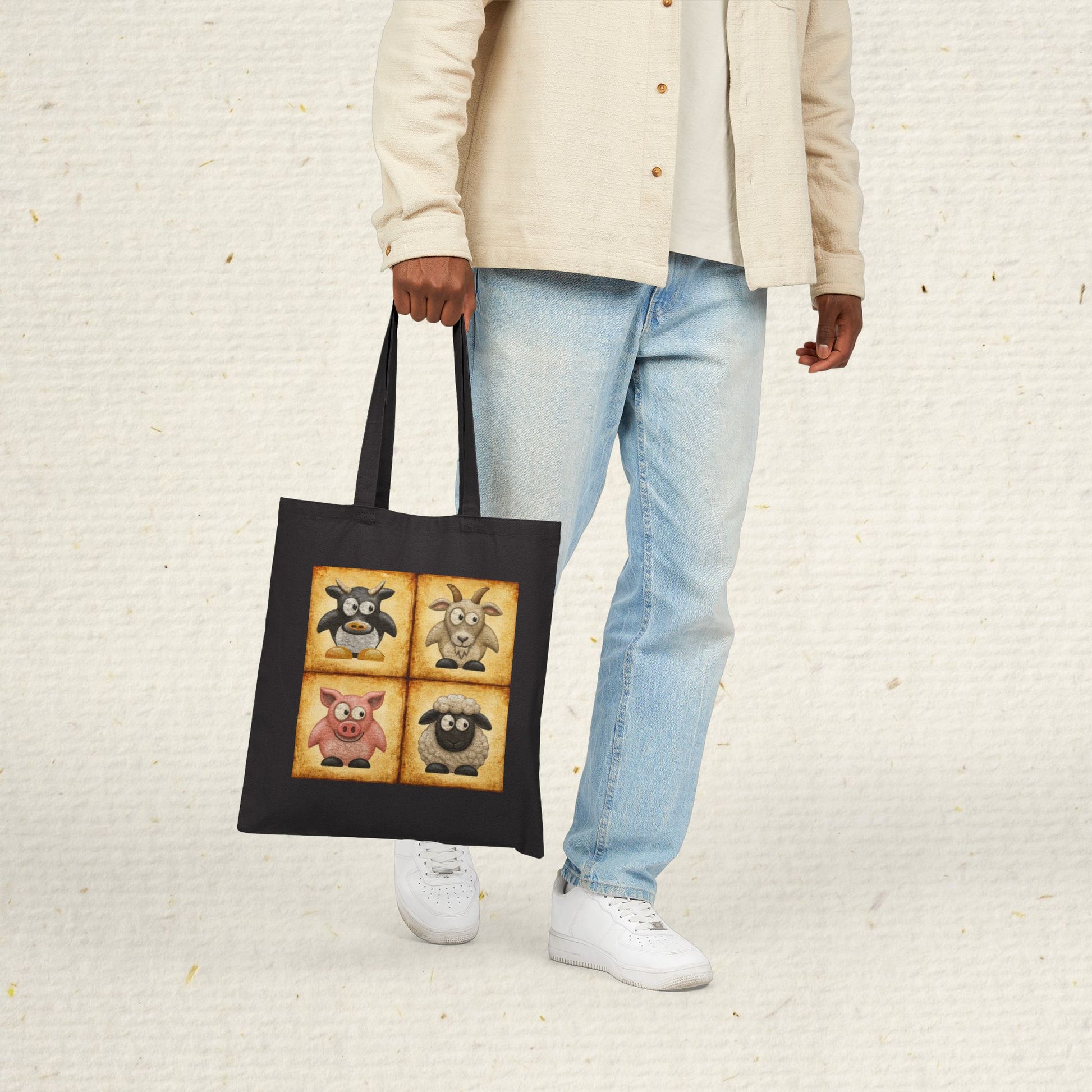 Black cotton canvas tote bag featuring vintage farm animal artwork with cow, goat, pig and sheep illustrations