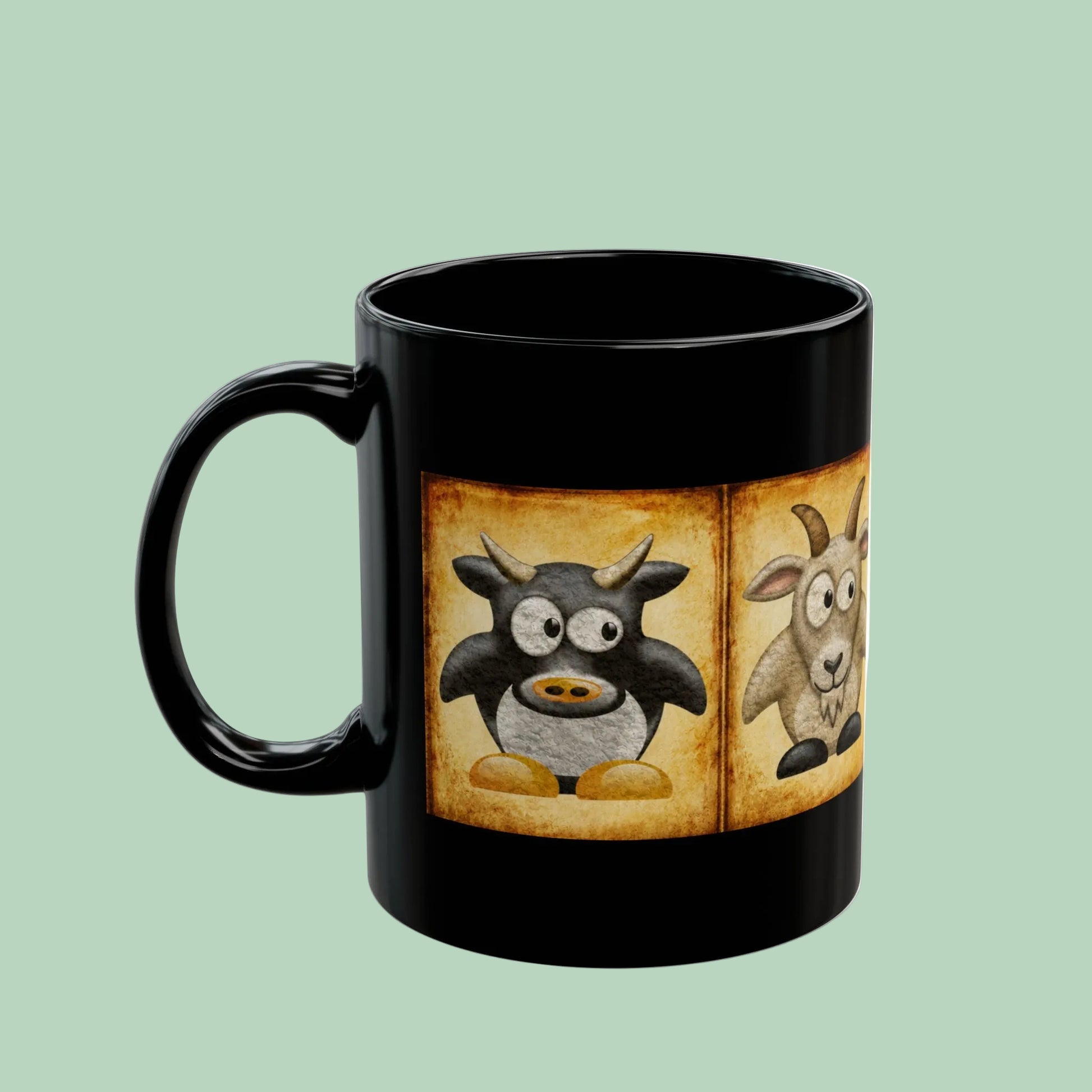 Black ceramic farm animal coffee mug featuring vintage goat pig and sheep artwork on a farmhouse-inspired design.