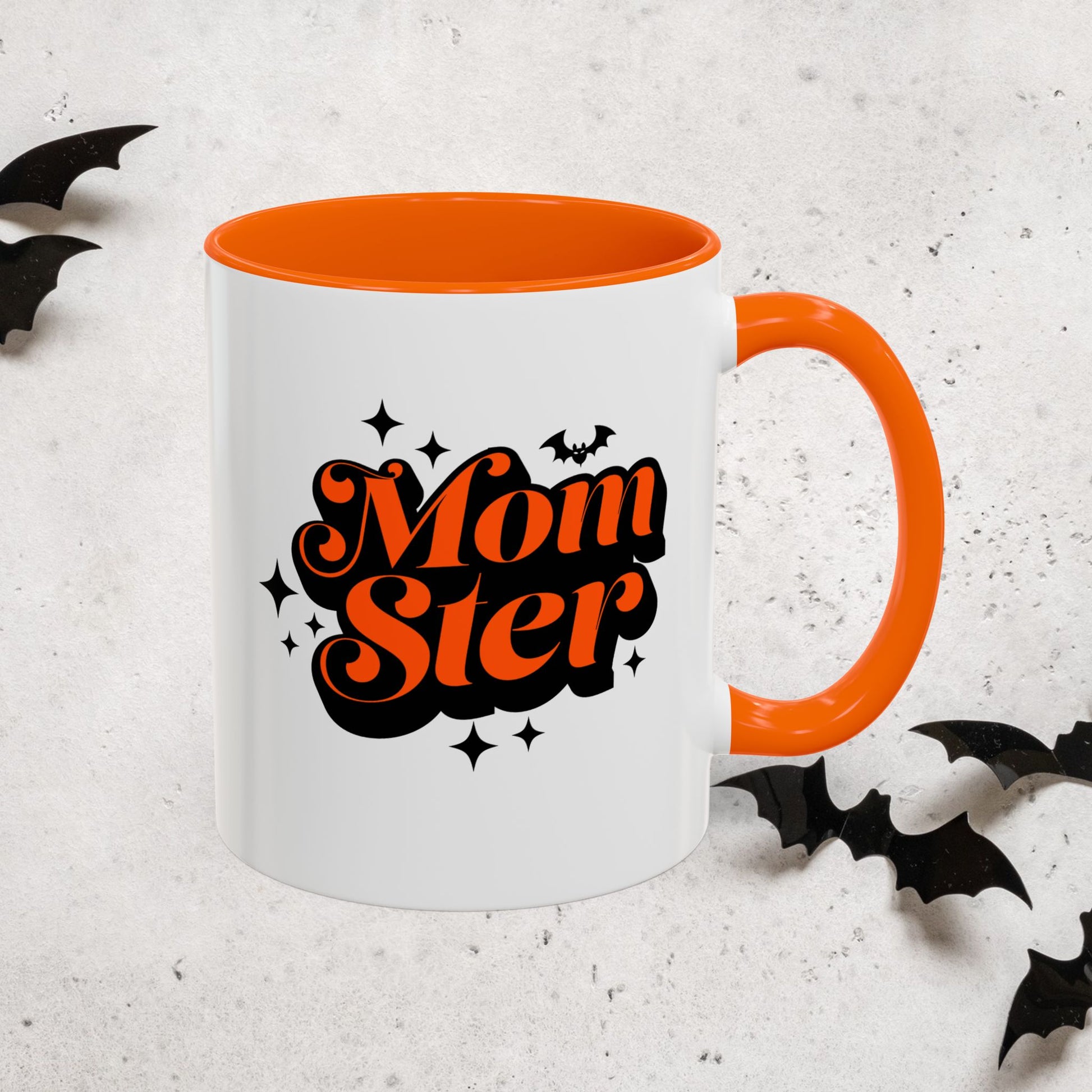 Halloween Mug with 'MomSter' text and orange interior on a light gray background with bats.