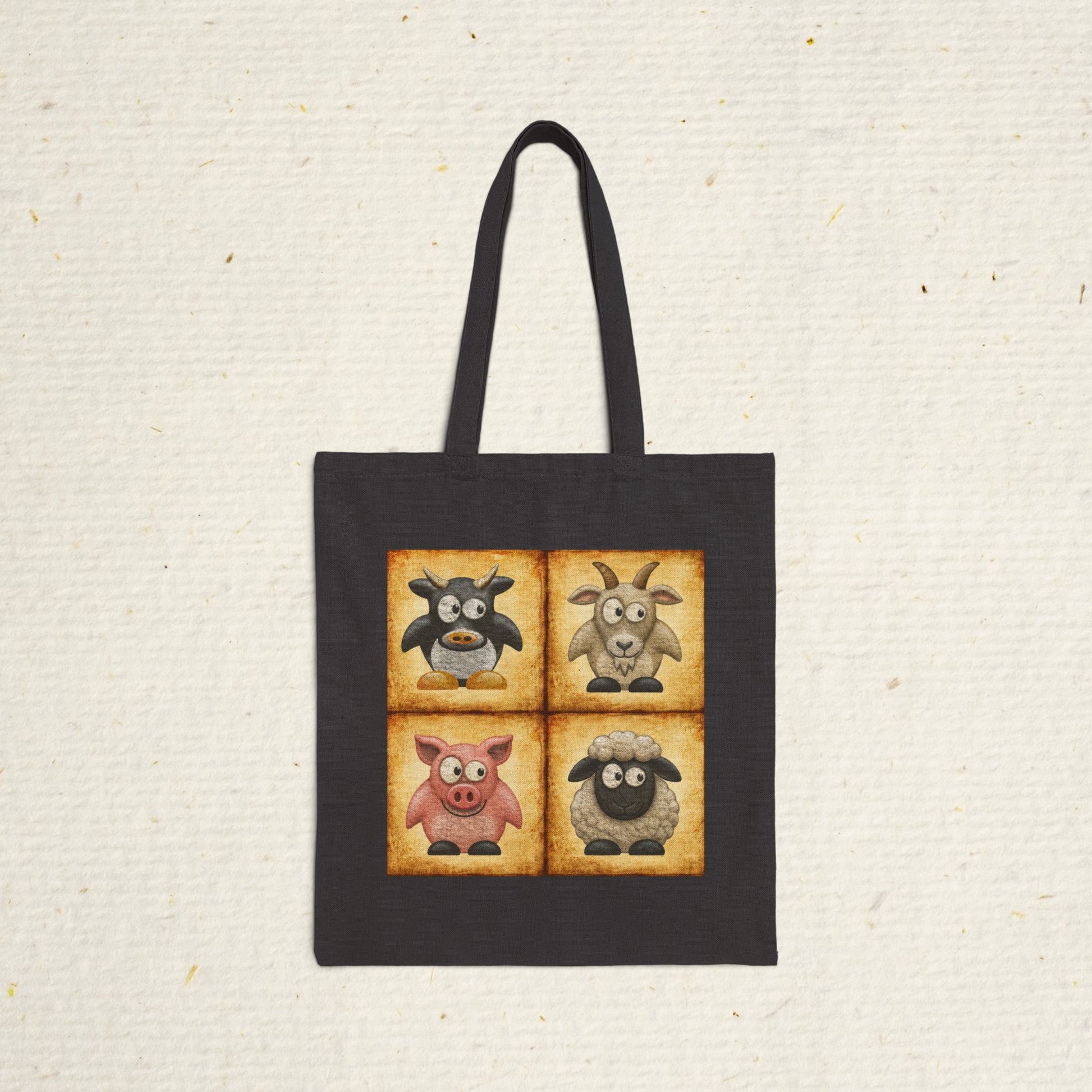 Black cotton canvas tote bag featuring vintage farm animal artwork with cow, goat, pig and sheep illustrations