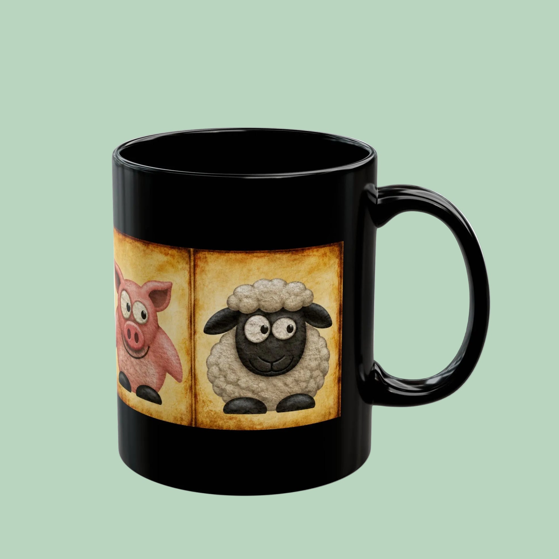 Black ceramic farm animal coffee mug featuring vintage goat pig and sheep artwork on a farmhouse-inspired design.