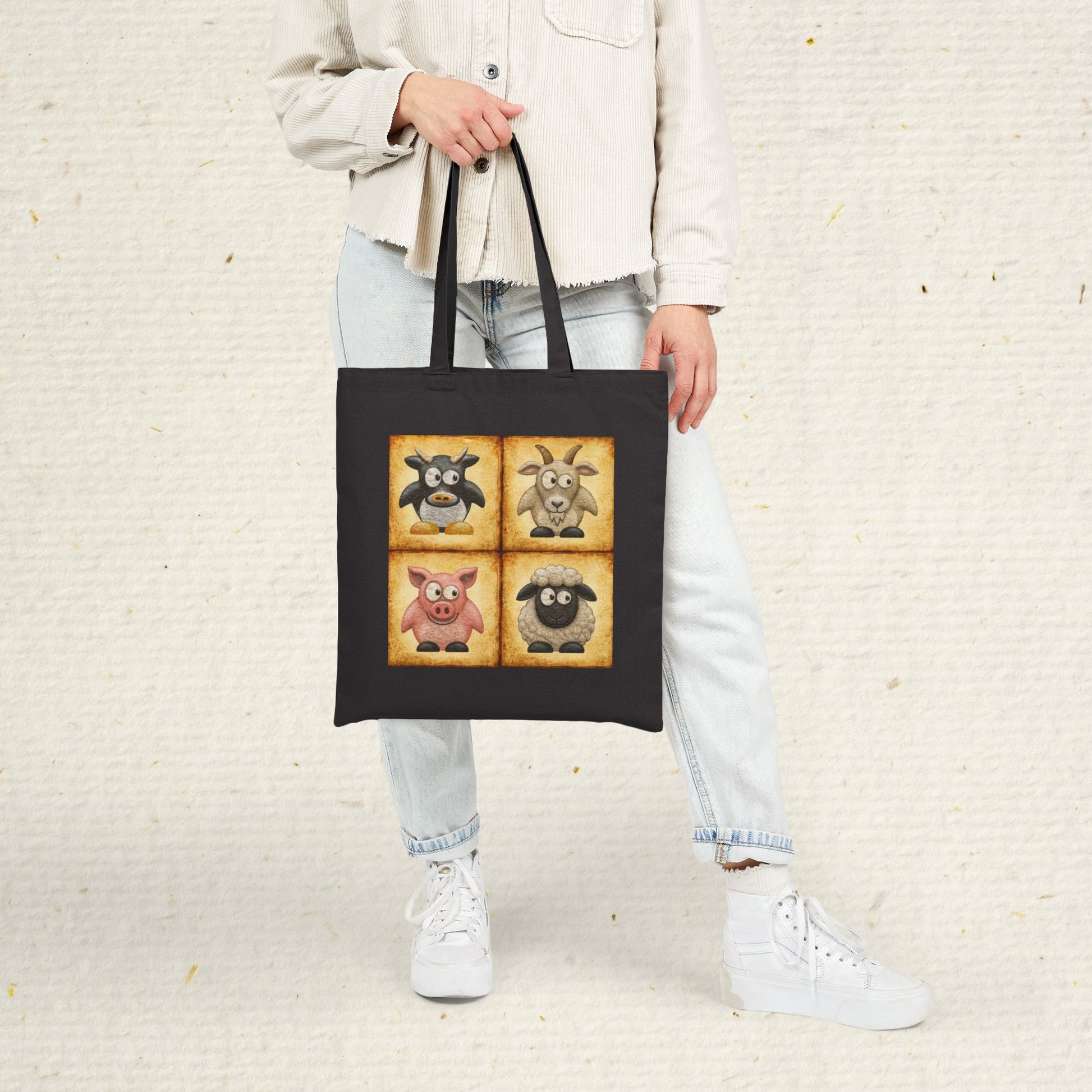 Black cotton canvas tote bag featuring vintage farm animal artwork with cow, goat, pig and sheep illustrations