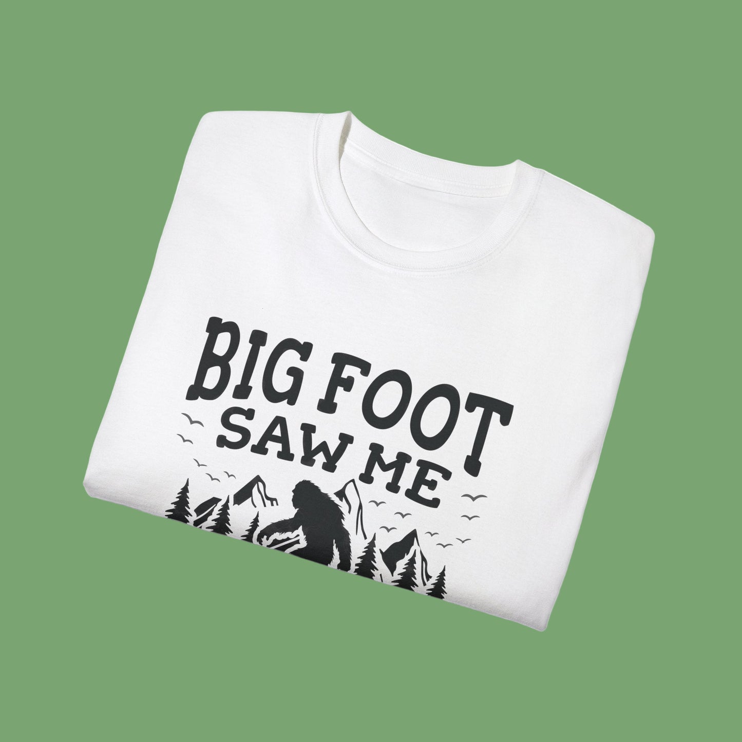 White sweatshirt with 'Big Foot Saw Me' text and graphic on a white background