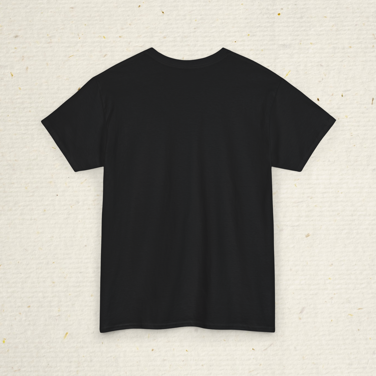 Black t-shirt on a textured beige background