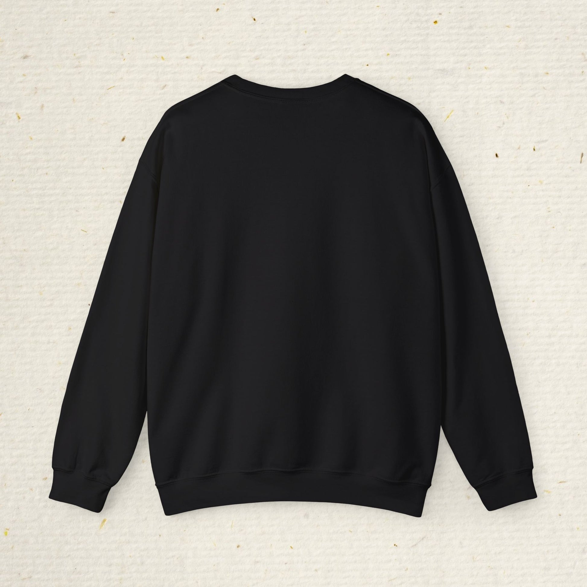 Black sweatshirt on a textured beige background