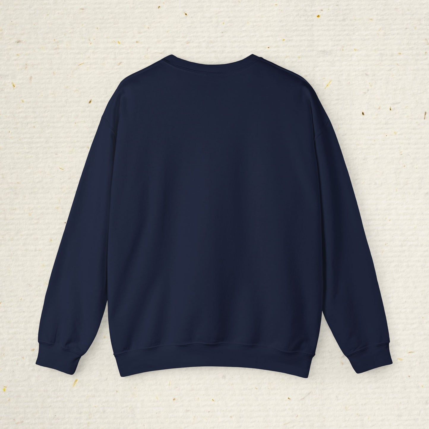 Navy blue sweatshirt on a textured beige background