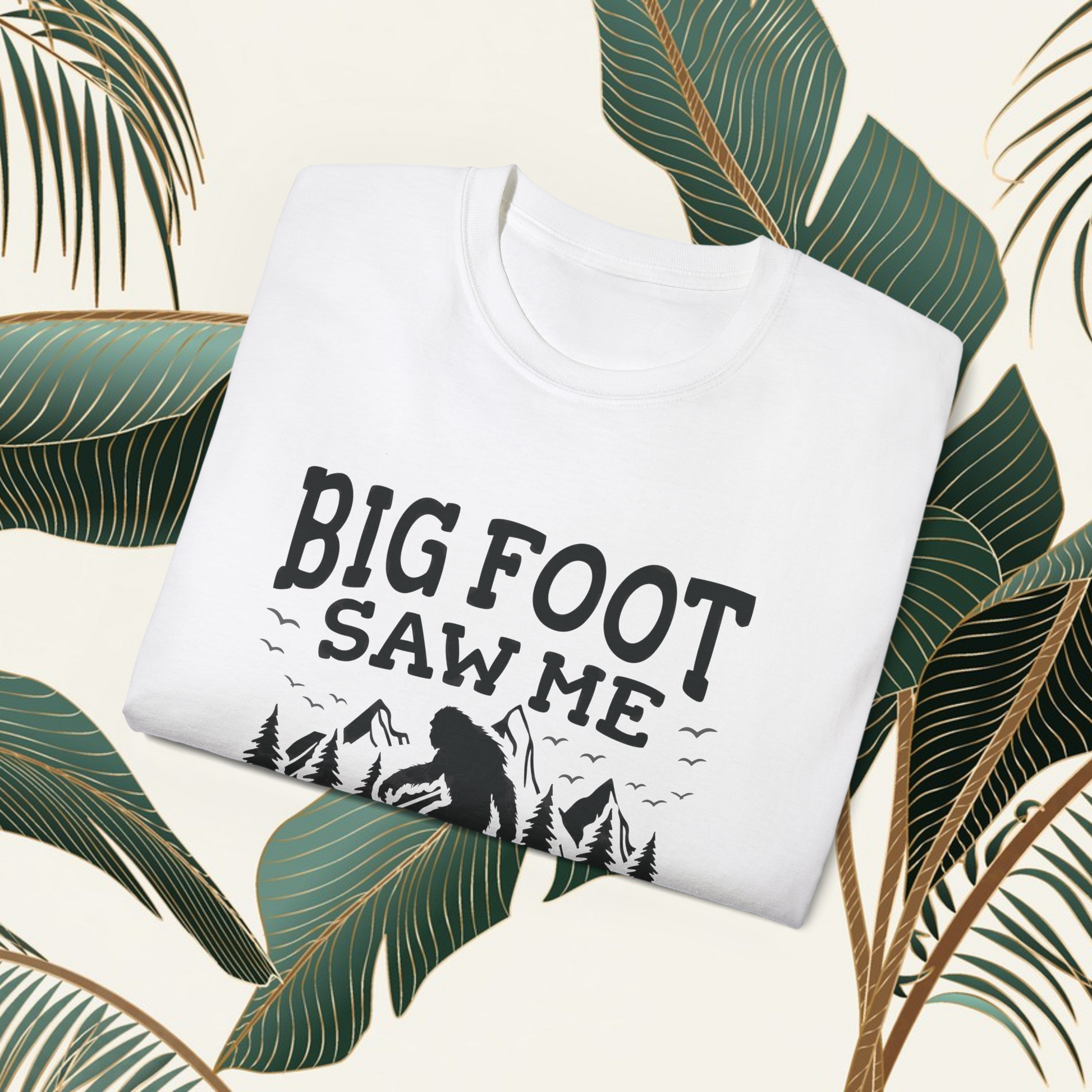 Person wearing a t-shirt with 'Big Foot saw me but nobody believes him' text outdoors.