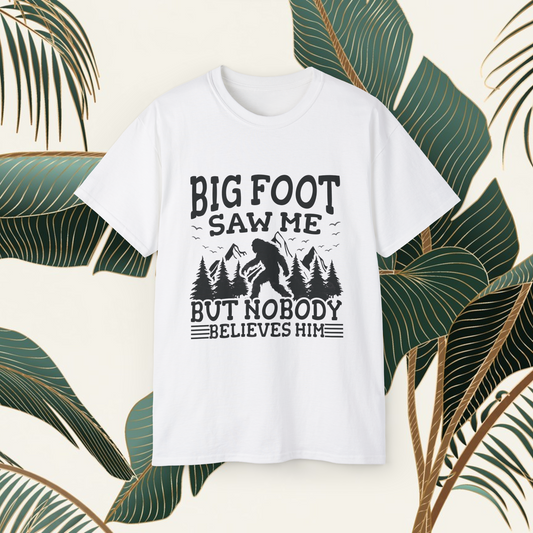 Person wearing a t-shirt with 'Big Foot saw me but nobody believes him' text outdoors.