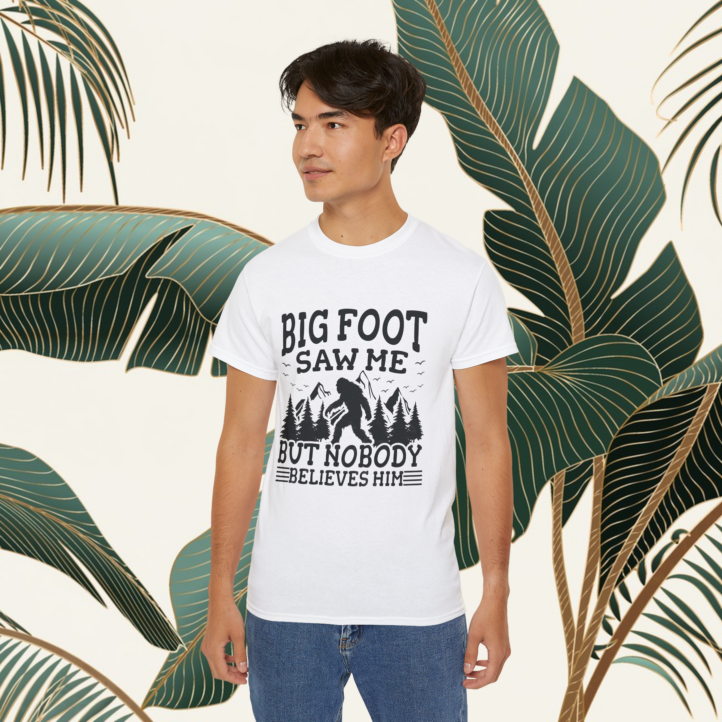 Person wearing a t-shirt with 'Big Foot saw me but nobody believes him' text outdoors.