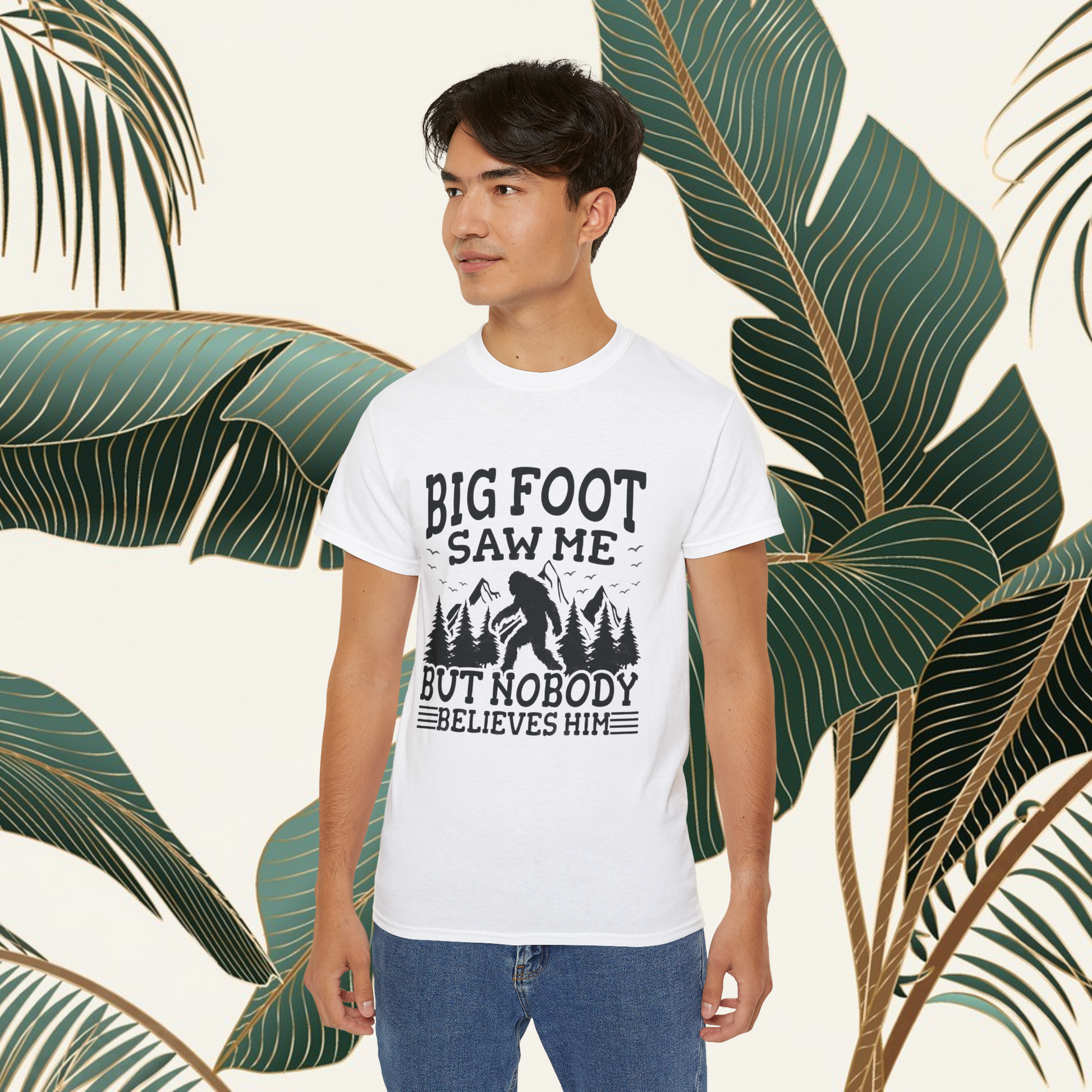 Person wearing a t-shirt with 'Big Foot saw me but nobody believes him' text outdoors.