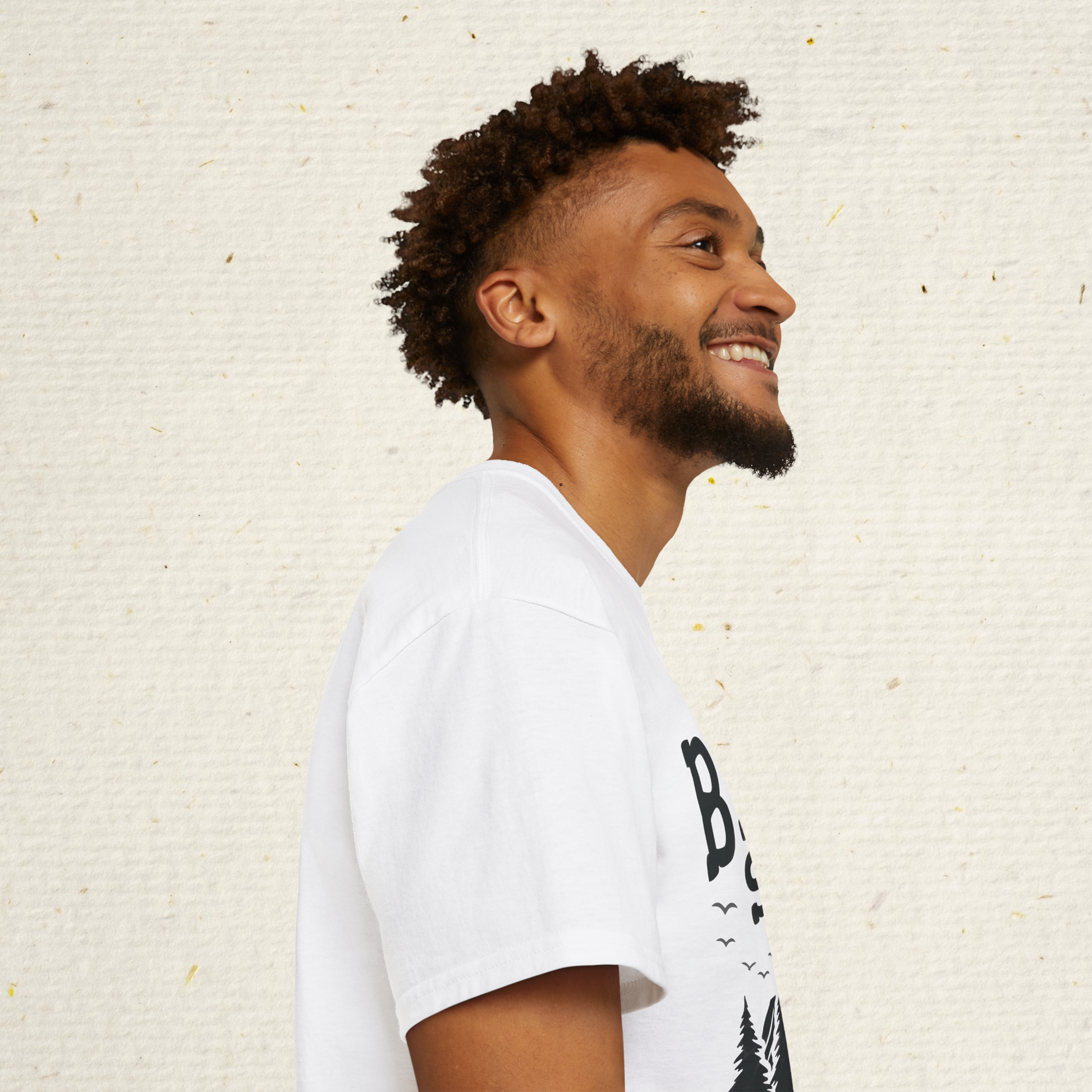 Person wearing a t-shirt with 'Big Foot saw me but nobody believes him' text outdoors.