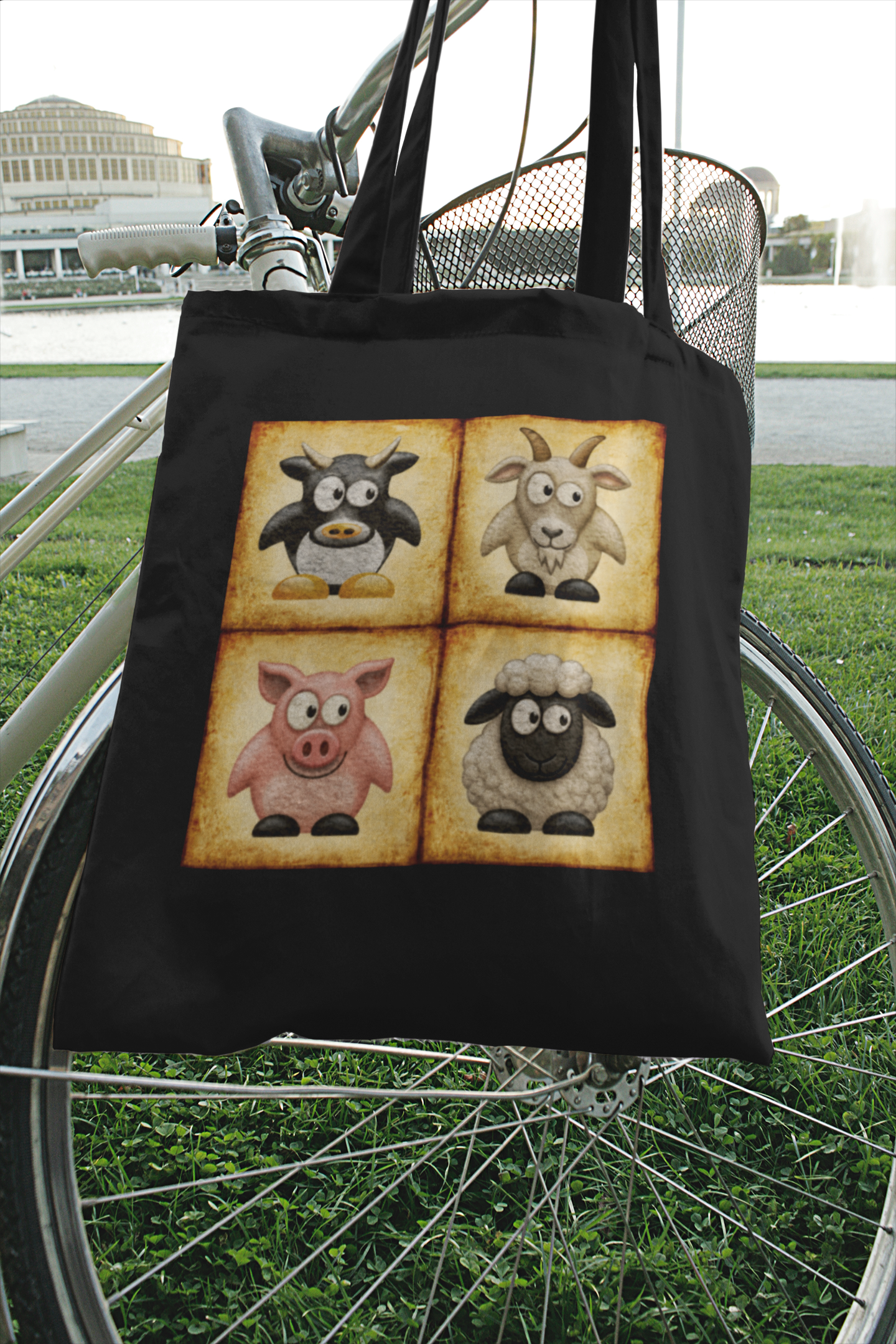 Black cotton canvas tote bag featuring vintage farm animal artwork with cow, goat, pig and sheep illustrations