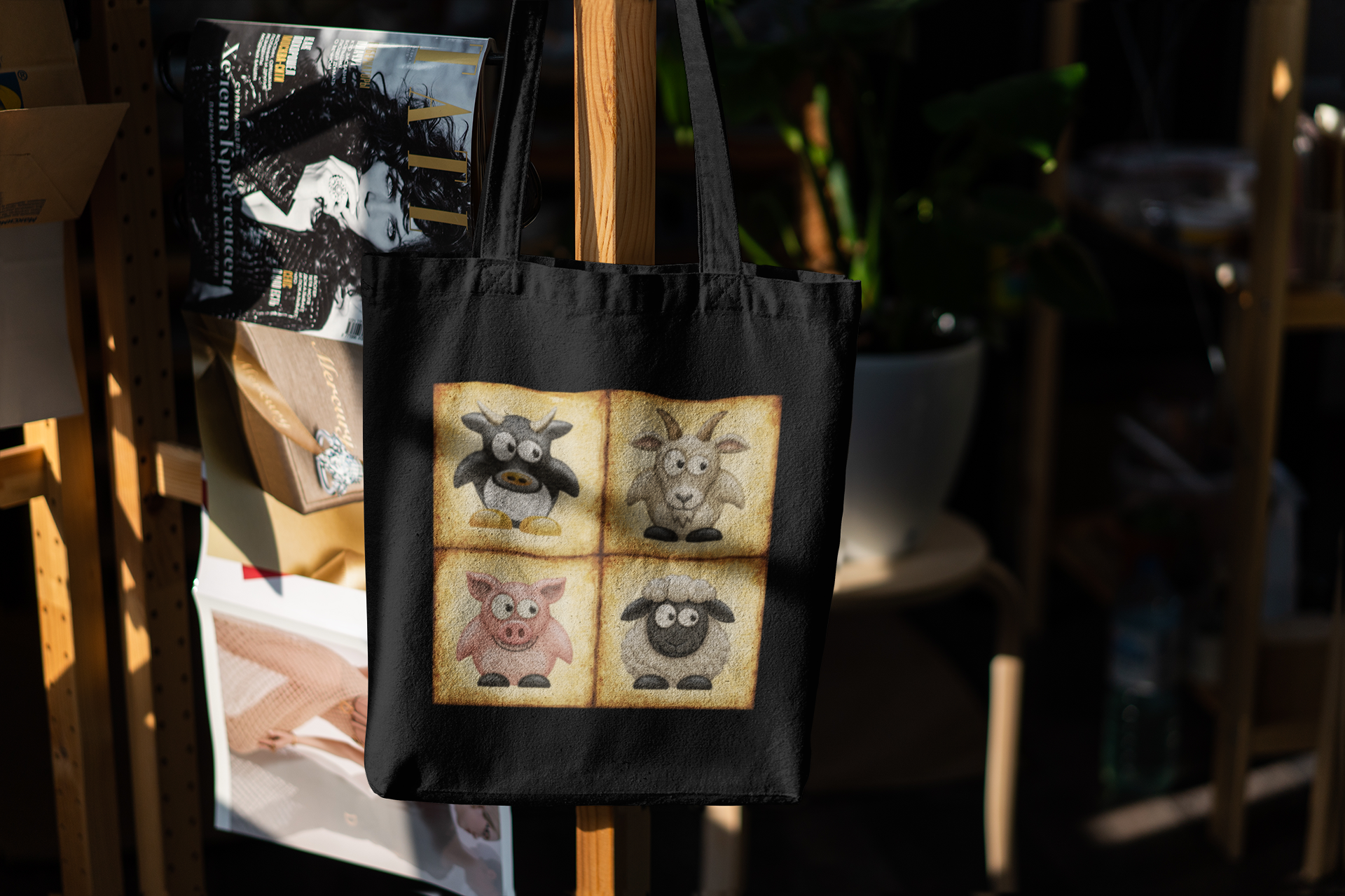 Black cotton canvas tote bag featuring vintage farm animal artwork with cow, goat, pig and sheep illustrations