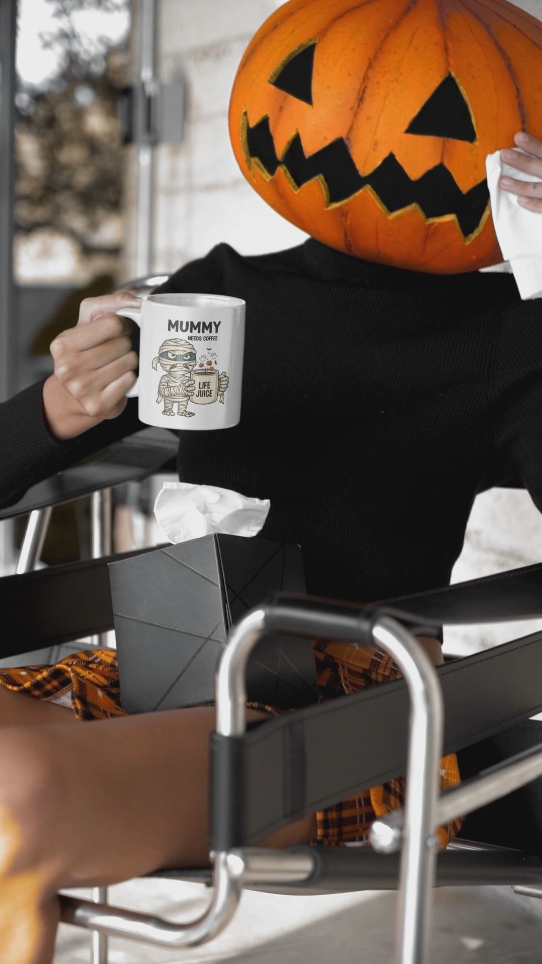 Halloween mug, mummy mug being used by a Halloween pumpkin momster.