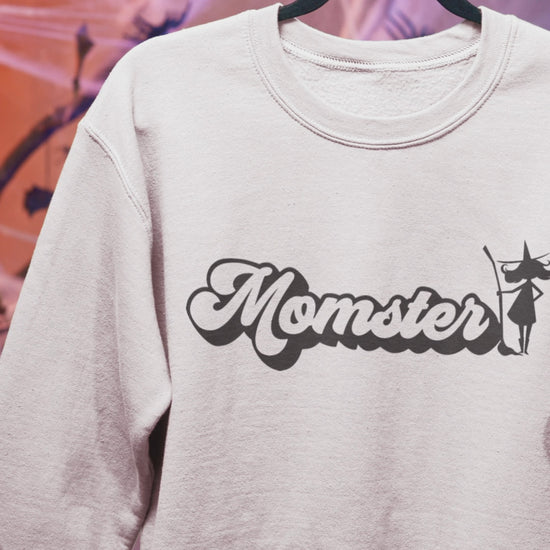 White sweatshirt with a Halloween witch 'Momster' design 