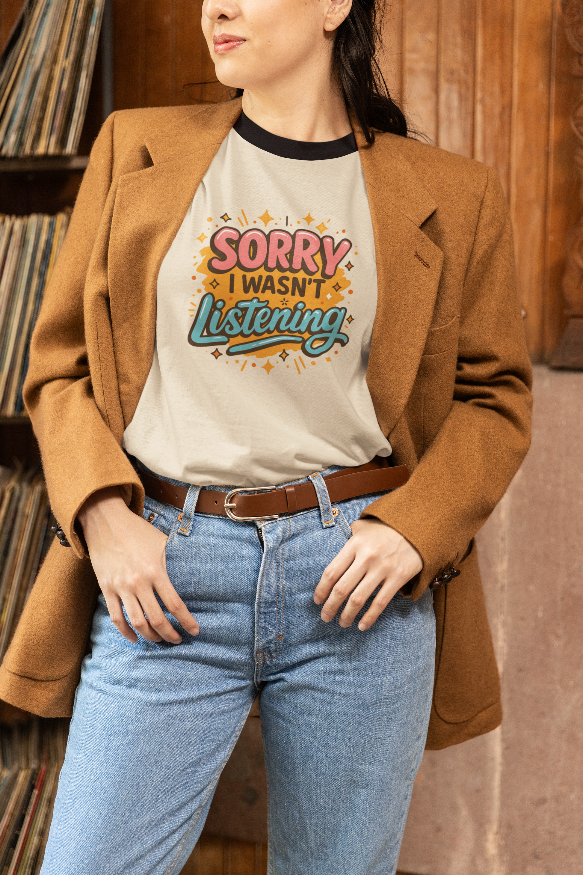 Person wearing a back to school t shirt 'Sorry I Wasn't Listening' in a record store.