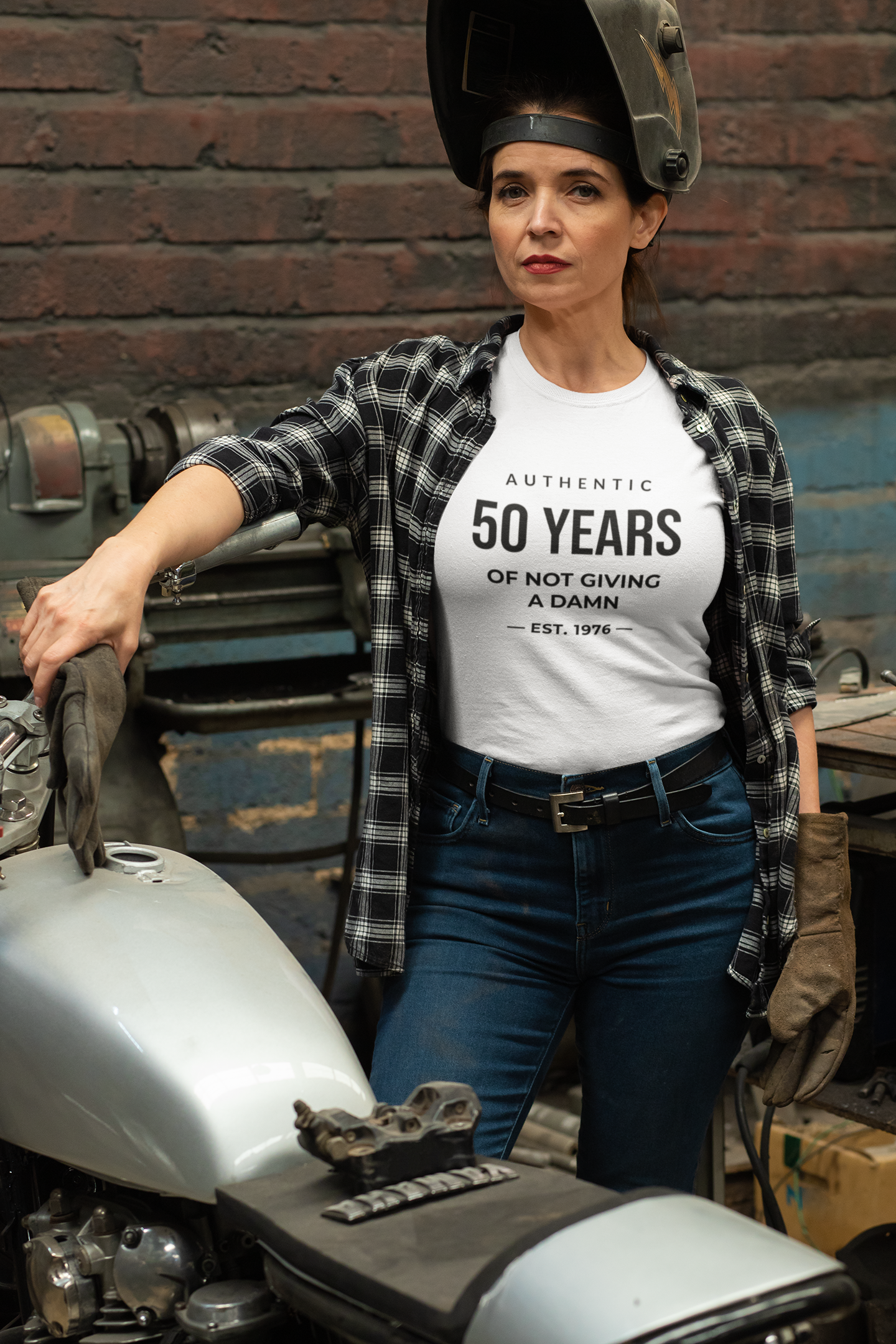 Women's funny 50th birthday t-shirt featuring Authentic 50 Years of Not Giving a Damn Est. 1976 graphic