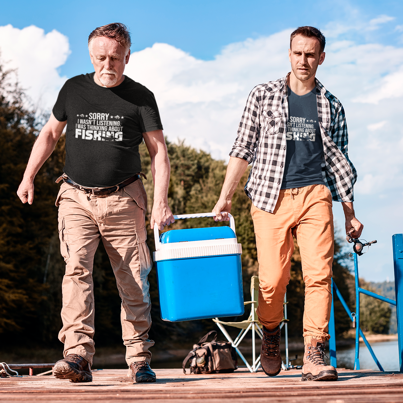 Men's fishing t shirts. Two men with a cooler on a dock by a lake